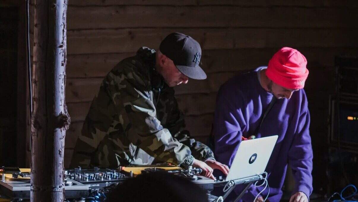 DJ duo performing with turntables and laptop at Lavery's, Belfast pub, creating vibrant nightlife atmosphere for live music and entertainment.