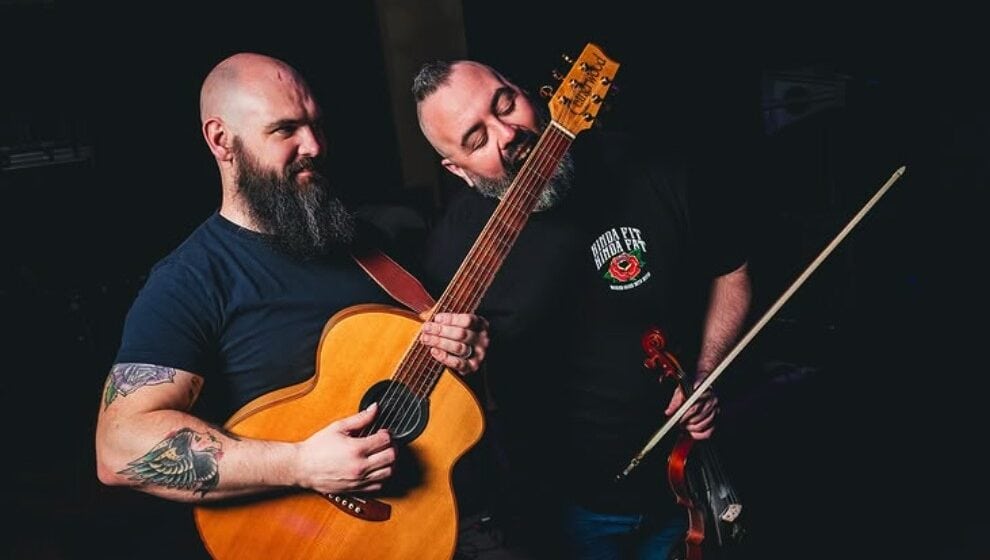Lavery's live music performance featuring guitar and violin, showcasing talented musicians in a lively setting, ideal for music lovers seeking memorable entertainment experiences.