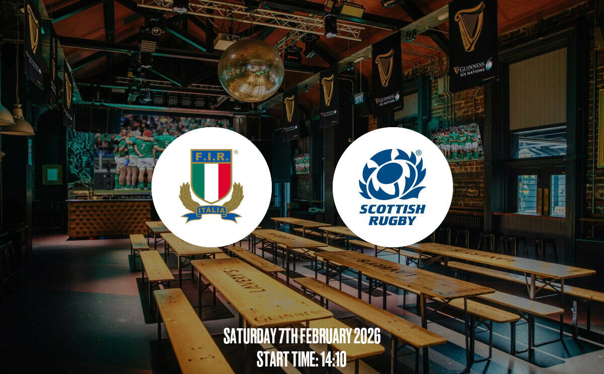 Indoor sports bar with large screens showing rugby matches, wooden benches, and Guinness banners, perfect for watching Scotland Rugby and Italy Rugby games, sports fans, and events.