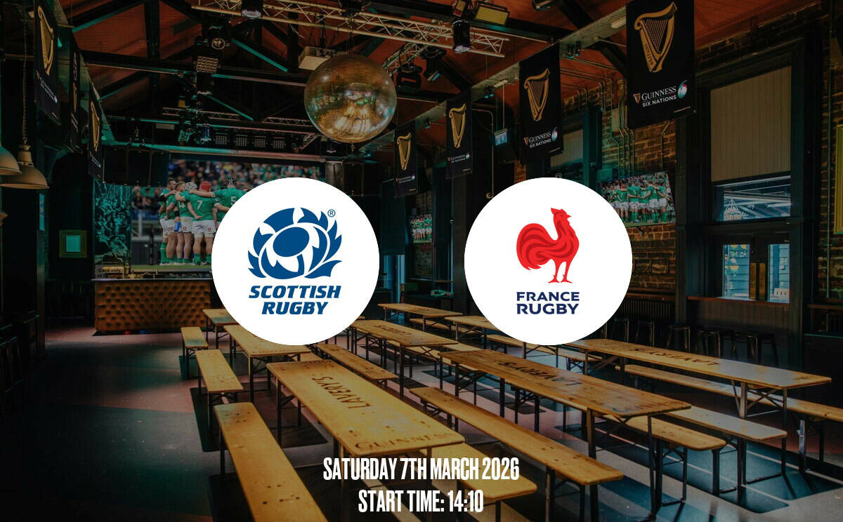 Modern sports bar decorated for rugby matches with Scottish and French rugby team logos, large screens, and a lively atmosphere. Ideal for watching Scotland vs France rugby game.