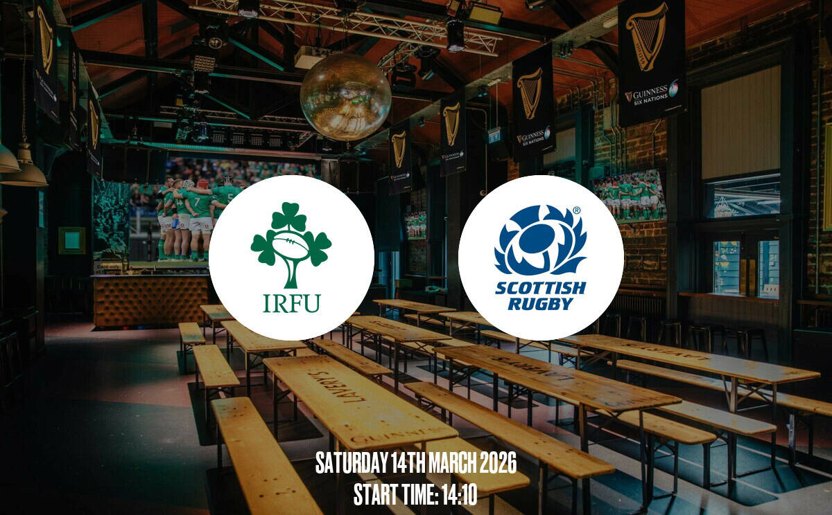 Cozy Irish pub interior with rugby fans, large screens, and Guinness banners, ideal for watching IRFU vs Scottish Rugby matches, creating a lively sports atmosphere.