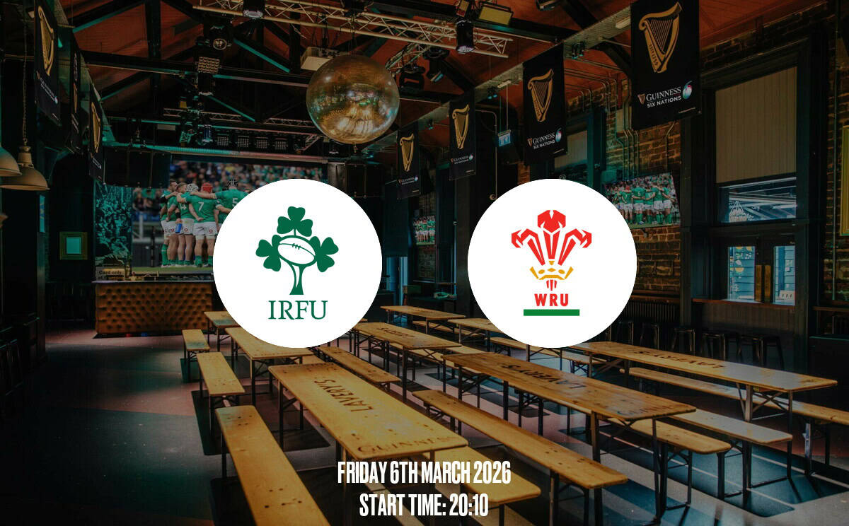 A lively pub displaying rugby match screens, with banners supporting Ireland and Wales rugby teams, perfect for fans to enjoy live sports in a vibrant atmosphere.